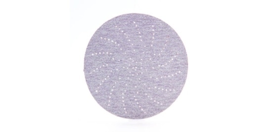 Un disque abrasif gris.
