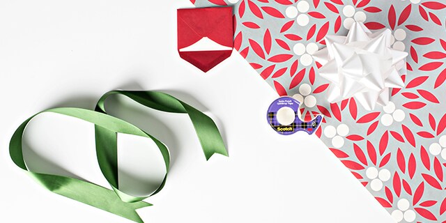 Gift wrapping supplies and Scotch® Brand Clear Tape.
