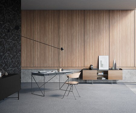 Un intérieur moderne et épuré, mariant marbre noir, béton et bois des finitions architecturales DI-NOC 3M.
