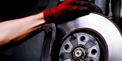 Man holding brake disc
