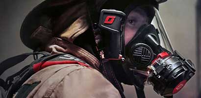 A worker person wearing a respirator.
