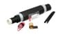 A black tube and three other metallic and plastic pieces that make up an electrical splice.