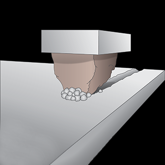 Illustration d’un grain céramique fragmenté.
