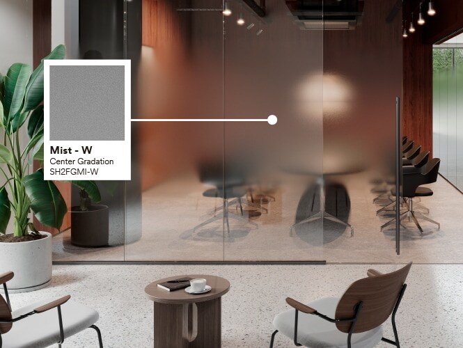 Modern office conference room featuring warm colours, stone floors and greenery with product callout of Mist glass finish.
