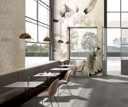 Cafe interior decorated with neutral tones and printed floral mural on graphic film covering walls.
