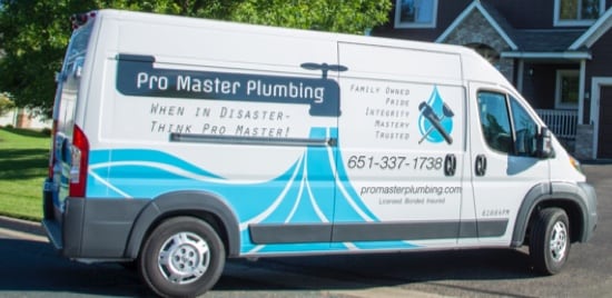 A cargo van wrapped in opaque coloured film to advertise Pro Master Plumbing.
