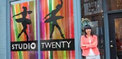 Windows of a building with two ballet dancers on them and the words: Studio Twenty.
