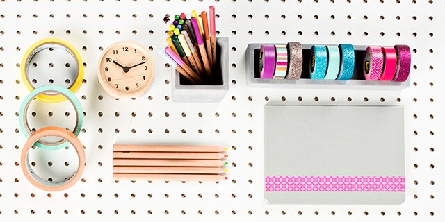 Scotch® Brand Tape and pencils on a peg board.
