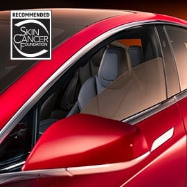 Exterior driver side close-up view of Crystalline window tint featuring Skin Cancer Foundation recommendation logo.