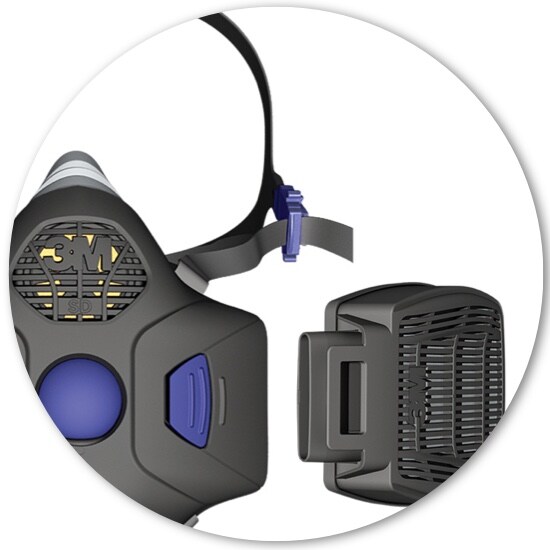 A close-up of a cartridge beside a 3M™ Secure Click™ Half Facepiece Reusable Respirator.
