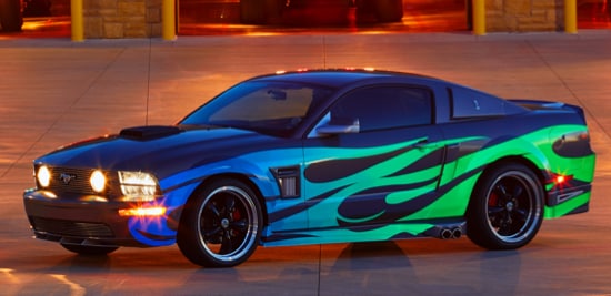 A car with blue-to-green gradient flames made from 3M™ Scotchlite™ Reflective Graphic Films.
