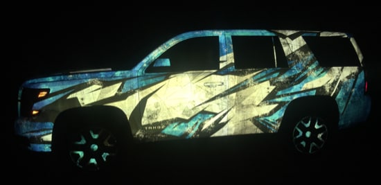 An SUV wrapped in a reflective graphic film.
