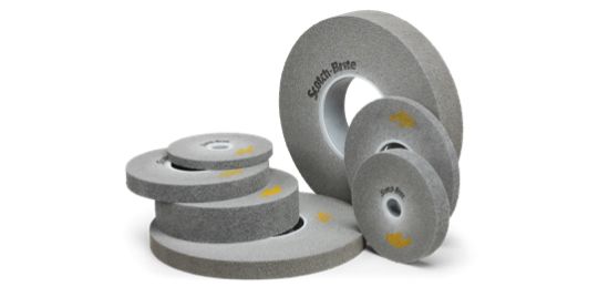 An assortment of deburring wheels of different sizes and thicknesses.

