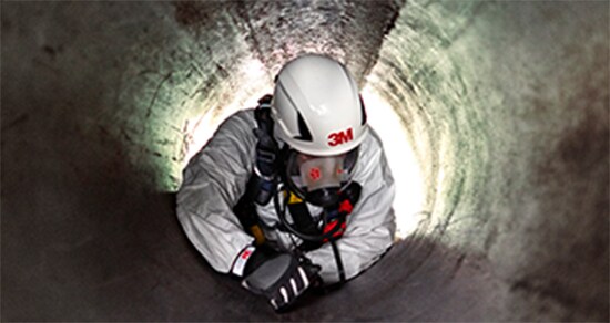 Front view of worker in confined space.
