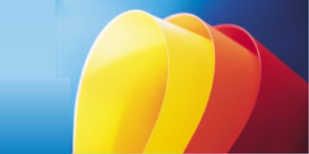 Curved samples of yellow, orange, and red solid colour films on blue background.

