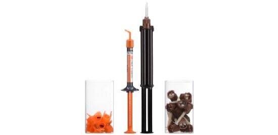 Two syringes beside containers containing their plastic waste.
